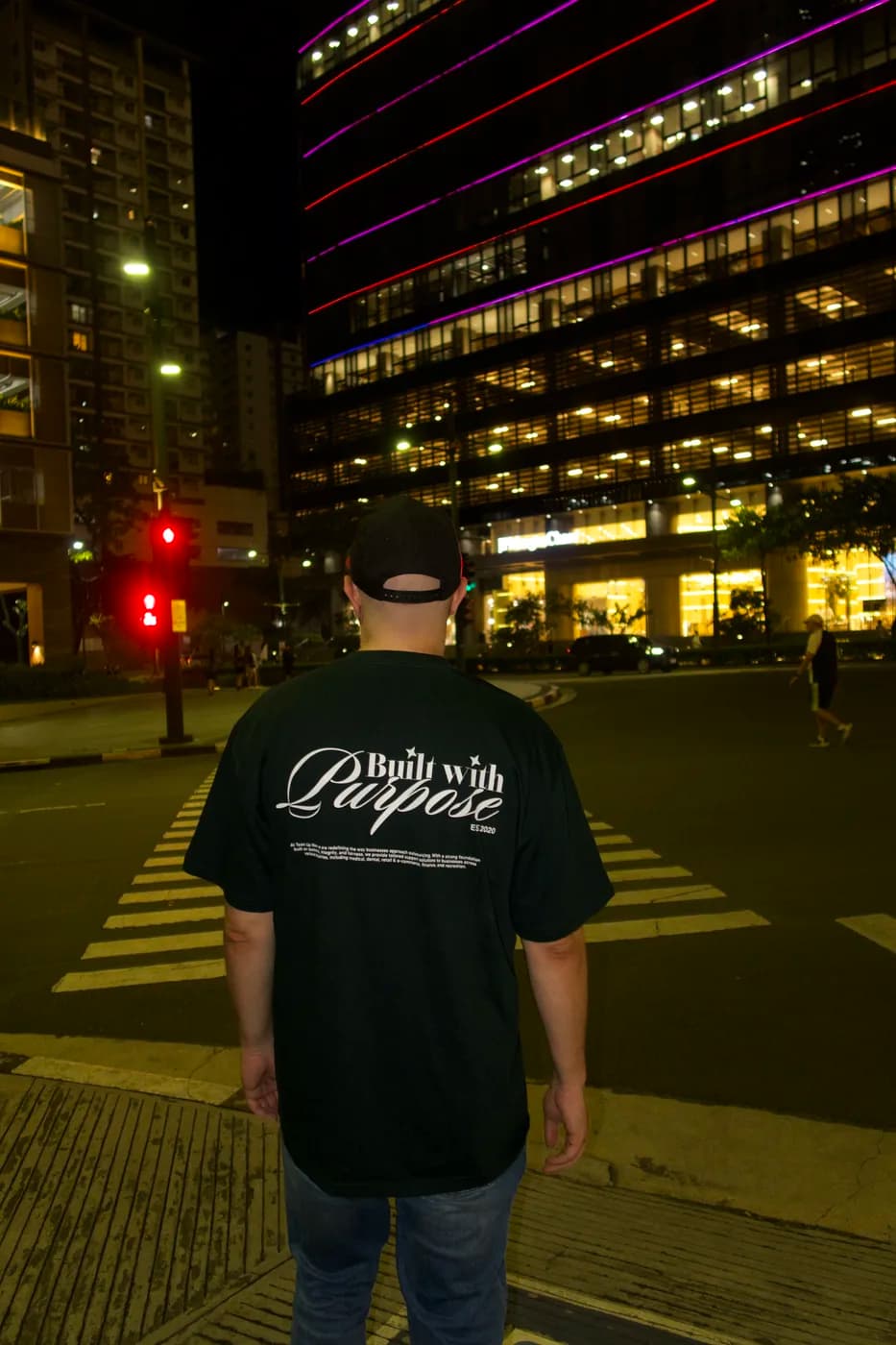 Walking through BGC at night beneath the illuminated towers