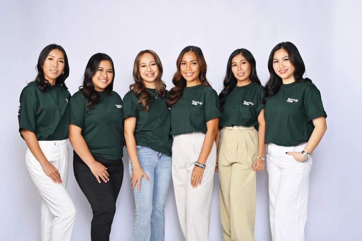 The Team Up Now Philippines team together
